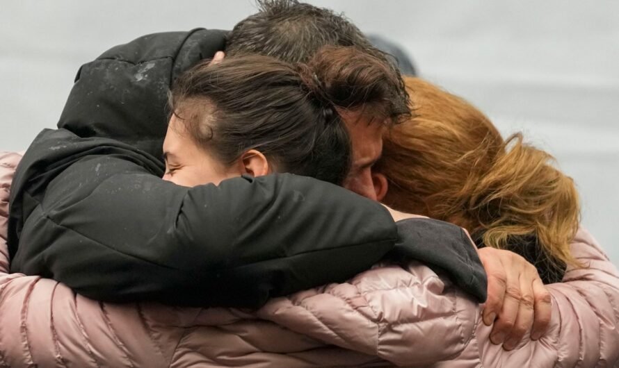 Flowers, candles, silence as Serbia marks the 1st anniversary of mass shooting at a Belgrade school