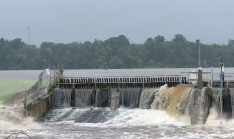 River Surges Over Wisconsin Dam Amid Heavy Rain, Imperiling Small City